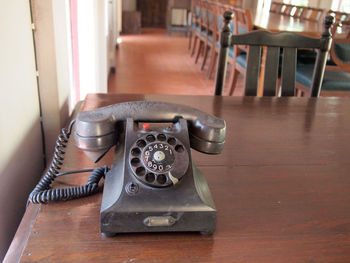 Close-up of telephone booth on table at home