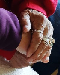 Close-up of couple holding hands