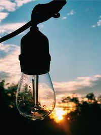 Low angle view of light bulb against sky