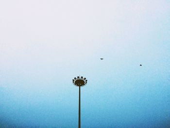 Low angle view of street light against sky