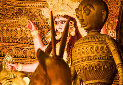 Goddess durga statue in jewelery and ceremonial make up during famous durga puja festival.