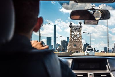 Man driving car in city