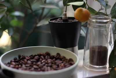 Close-up of coffee beans in glass on table