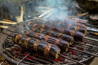 High angle view of food in skewers on barbecue grill