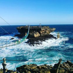 Scenic view of sea against clear blue sky