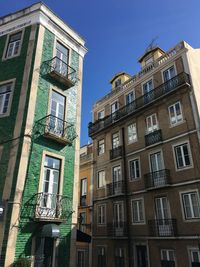 Low angle view of building against blue sky