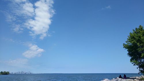 Scenic view of sea against blue sky