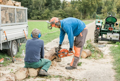 View of lumberjack working on field