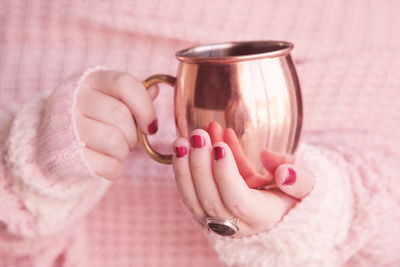 Close-up of hand holding drink