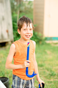 Portrait of a smiling boy outdoors with a snorkel