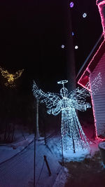 Close-up of illuminated christmas lights in winter