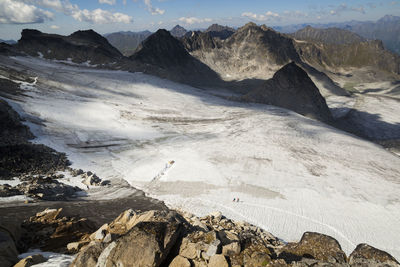 Hikers cross snowbird glacier, talkeetna mountains, alaska