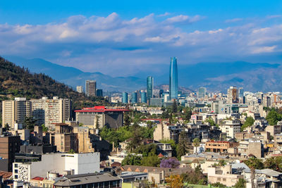 High angle view of buildings in city against sky