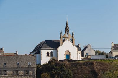 Low angle view of buildings against clear sky