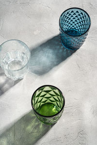 High angle view of drinking glass with water on table