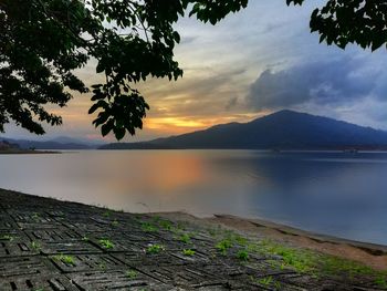 Scenic view of lake against sky during sunset