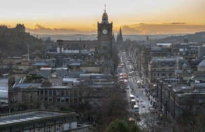 High angle view of buildings in city during sunset