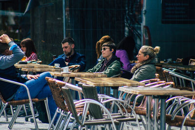 Group of people sitting on table