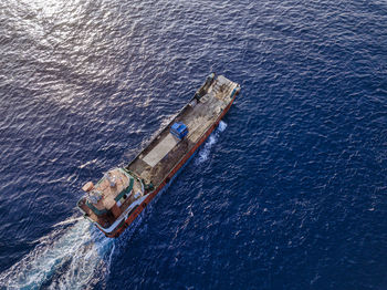 Aerial view of barge transporting single truck