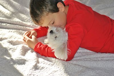 High angle view of boy sleeping on bed at home