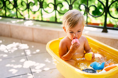 Boy sitting in toy