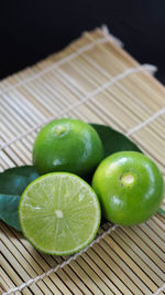 Close-up of green fruits on table