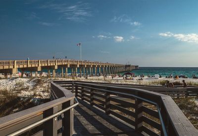 Pier over sea against sky