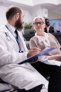 Doctor examining patient in hospital