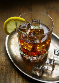 Close-up of whiskey in glass on table