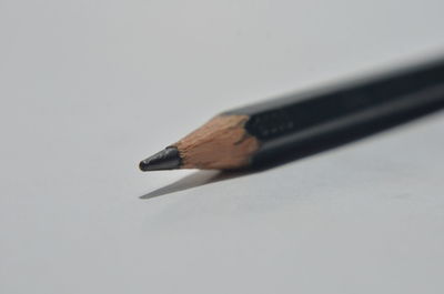 Close-up of colored pencils against white background