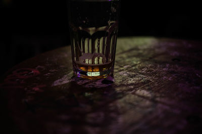 Close-up of beer glass on table