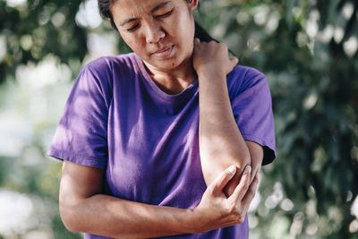 Woman suffering from elbow pain