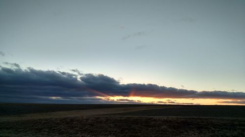 Scenic view of landscape at sunset