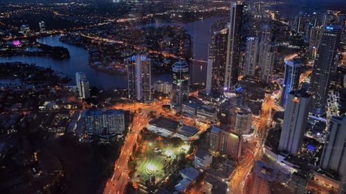 High angle view of illuminated cityscape at night