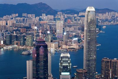 Aerial view of city buildings at waterfront