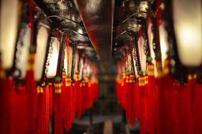 Close-up of lit candles in temple
