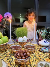 Close-up of nowruz decorations with cute girl 