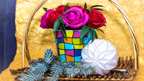 Close-up of multi colored flower vase on table