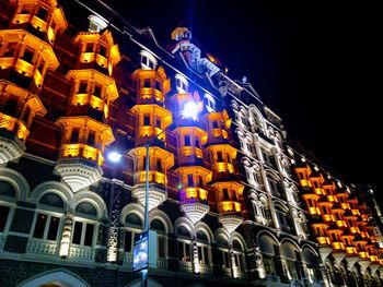 Low angle view of illuminated building at night