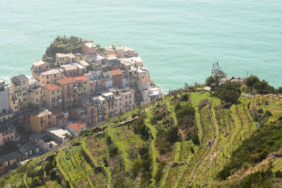 High angle view of townscape by sea