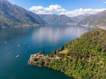 High angle view of lake amidst mountains against sky