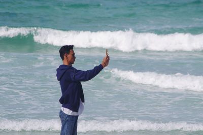 Full length of man standing at beach