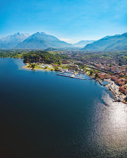 Scenic view of lake and mountains against blue sky