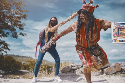 Representation of inca warrior dressed and with battle, prehispanic fighting with a tourist in peru