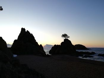 Scenic view of sea against clear sky during sunset