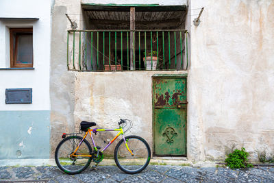 Bicycle against wall of building