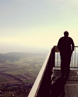 Rear view of man standing on observation point