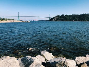 View of suspension bridge over sea