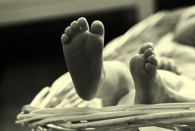 Low section of boy lying down