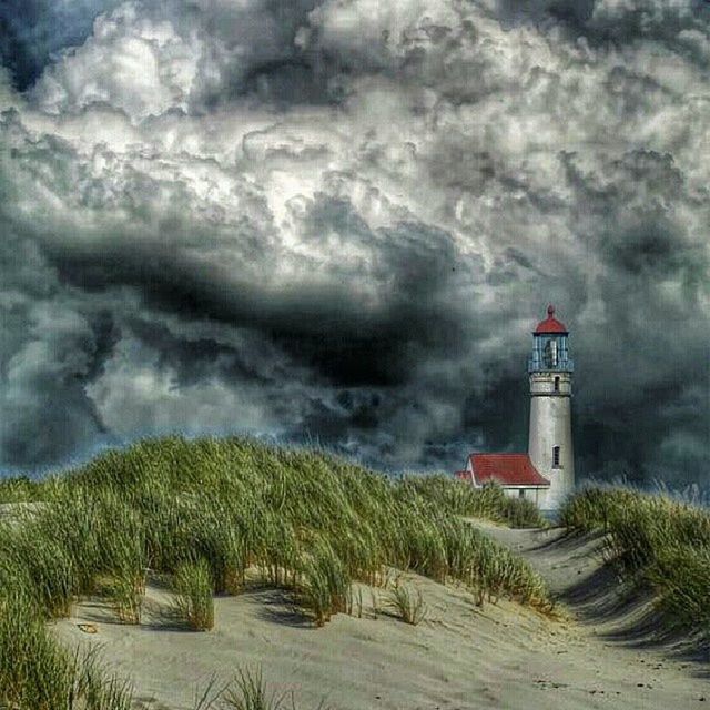 sky, lighthouse, cloud - sky, building exterior, architecture, cloudy, built structure, guidance, weather, direction, water, overcast, cloud, protection, storm cloud, nature, safety, tower, tranquility, field